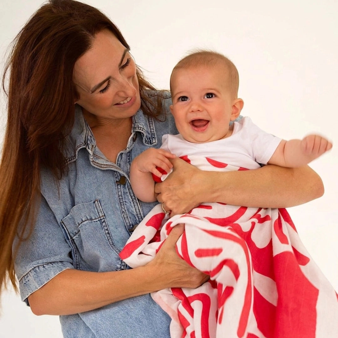 GOLDEN CHILD Holiday Swaddle RED + MILK